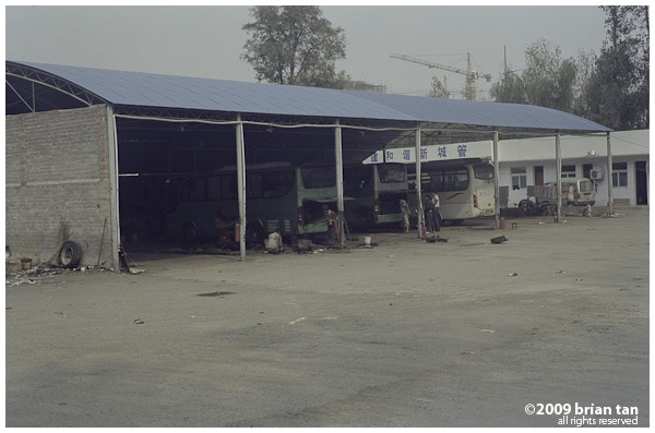 Just outside Zhoukou, the bus stops at this workshop to fill up the fuel tanks.